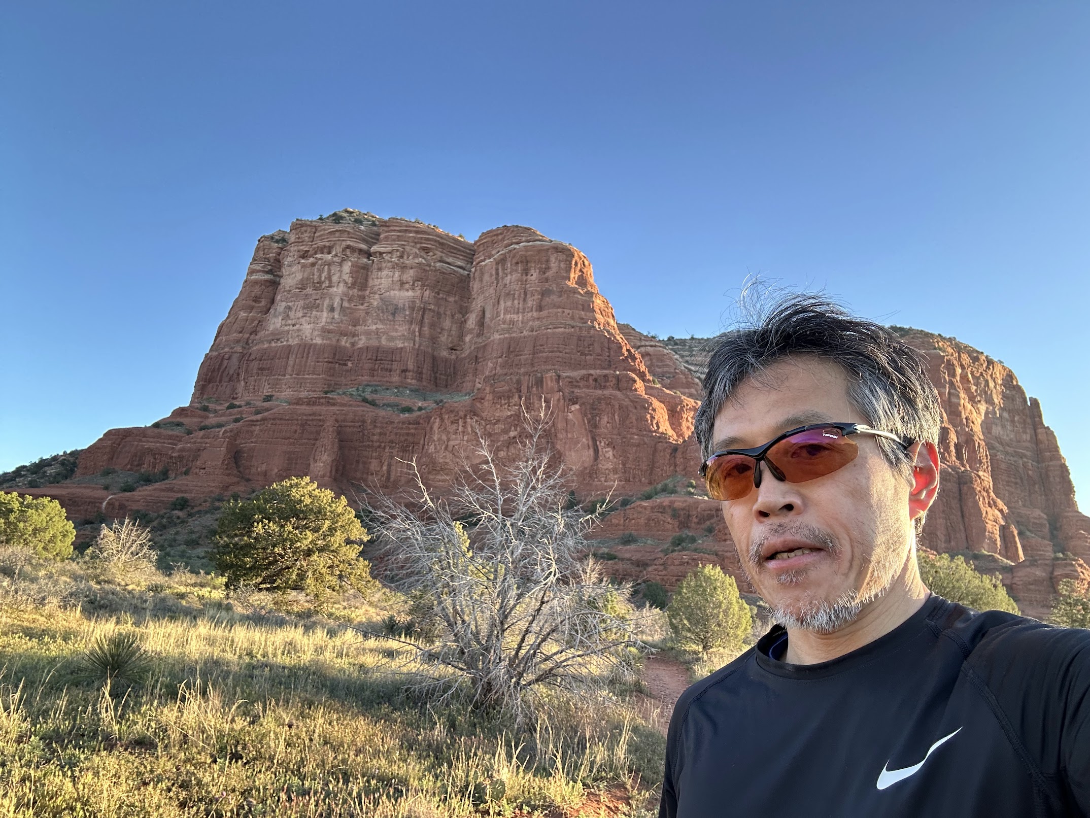 Ryu on a morning run in front of red rock formations